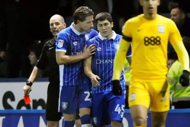 Sam Hutchinson has a word with Sheffield Wednesday's Fernando Forestieri after he was sent off against Preston.