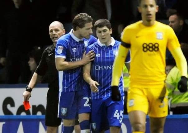 Sam Hutchinson has a word with Sheffield Wednesday's Fernando Forestieri after he was sent off against Preston.