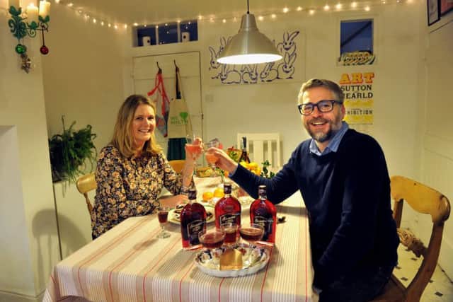 Claire and Joff toasting Christmas with Sloe Royales - a mix of Sloemoton gin and prosecco.
