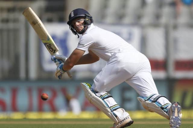 England's batsman Jos Buttler hits one to square leg during England's first innings in Mumbai. Picture: AP/Rafiq Maqbool.