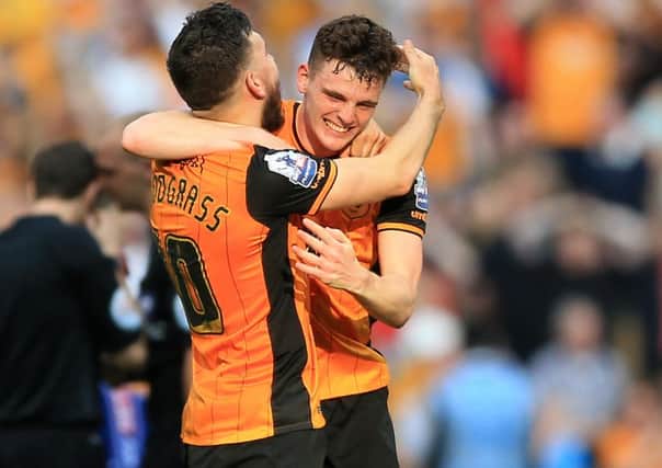 Hull City's Robert Snodgrass, left, and Andrew Robertson celebrate victory at the final whistle and promotion to the Premier League at Wembley (Picture: PA).