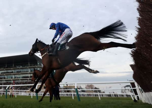 Theatre Guide ridden by Paddy Brennan on their way to victory in the Unicoin Group Handicap Chase during day one of the International meeting at Cheltenham Racecourse. (Picture: David Davies/PA Wire)