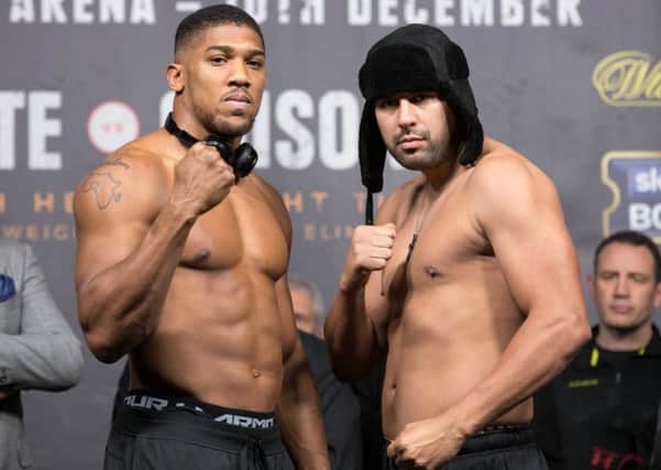 Anthony Joshua and Eric Molina during the weigh in.