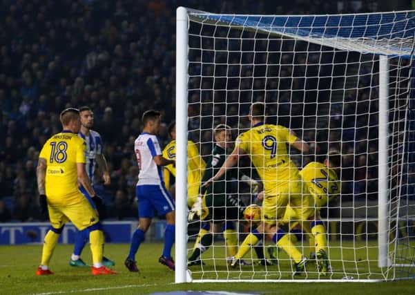Leeds United midfielder Kalvin Phillips, right, blocks the ball with his arm, which saw him sent off and Brighton awarded the first of two penalties that enabled them to beat their visitors and go top of the Championship (Picture: Gareth Fuller/PA).