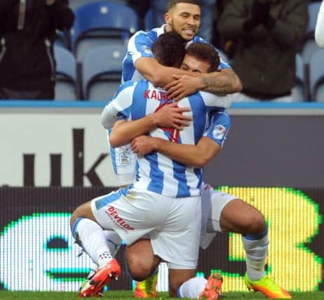 Huddersfield Town players celebrate Elias Kachunga's goal.  (Picture: Tony Johnson)
