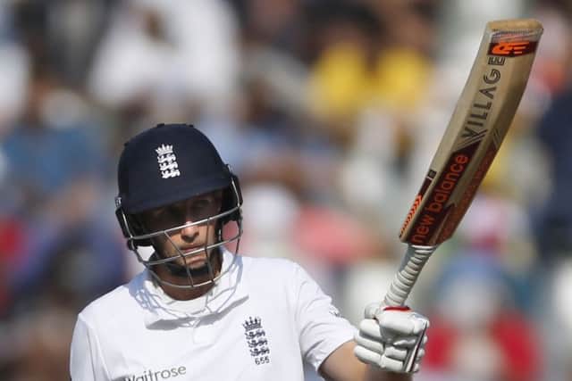 England's batsman Joe Root raises his bat after scoring 50 runs on the fourth day of the fourth cricket test match between India and England in Mumbai (AP Photo/Rafiq Maqbool)