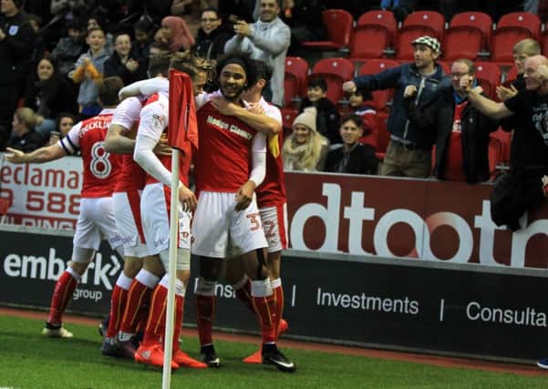 Izzy Brown scores for Rotherham and is mobbed by team-mates in the win over QPR. (Picture: Chris Etchells)
