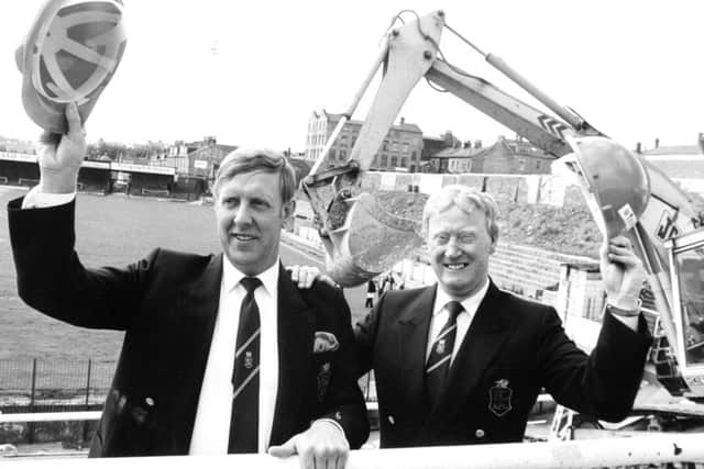 It was helmets off for Bradford City chairman Stafford Heginbotham (left) and his vice-chairman and project director Jack Tordoff as work started on the Â£2.3m. contract to rebuild the fire ravaged Valley Parade Ground.