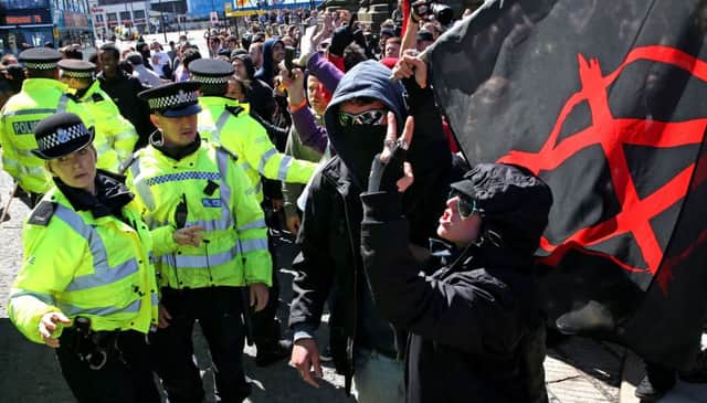 Police intervene in Liverpool to protect members of National Action, as the neo-Nazi movement is to become the first extreme right-wing group banned as a terrorist organisation