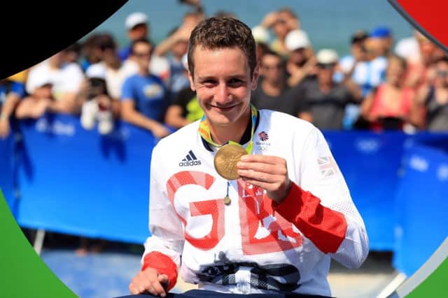 Leeds' Alistair Brownlee with his gold medal for the men's Triathlon in Brazil. Picture: PA.