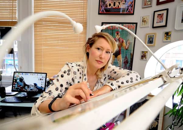 Date: 12th August 2014, (JH1004/71a). Comic book illustrator Lisa Wood, director of Thought Bubble, a comic book festival to held in Leeds in November with funds raised going to this years charity Barnardos.