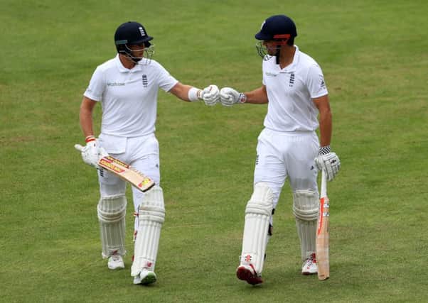 England's Joe Root (left) and captain Alistair Cook. Picture: Richard Sellers/PA