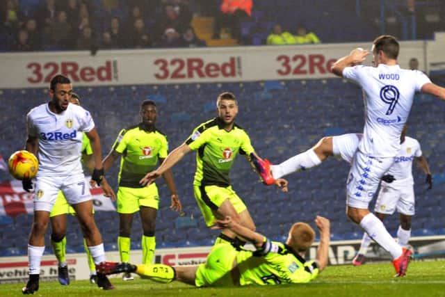 Chris Wood puts Leeds United in front against Reading at Elland Road last night. They went on to win 2-0 but Wood departed early with an injury (Picture: Bruce Rollinson).