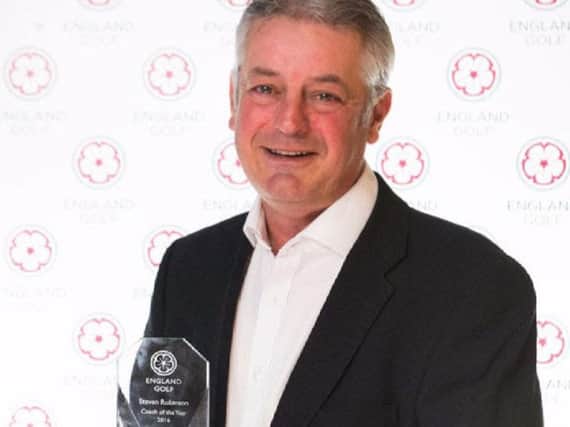 Sandburn Hall's Steve Robinson with his award as England Golf's Coach of the Year.