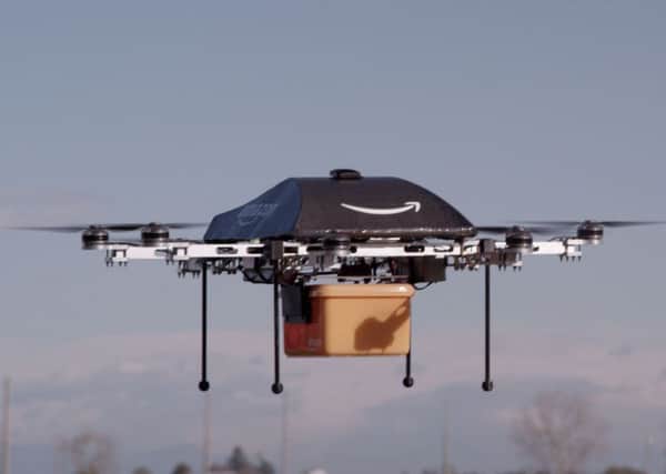 The Amazon drone which has completed it's first ever delivery in Cambridgeshire. See Masons copy MNAMAZON: Amazon, the US tech giant, has launched the first delivery of goods in thirty minutes using drone technology in idyllic Cambridgeshire. The billionaire founder of Amazon announced on Twitter that: "First-ever #AmazonPrimeAir customer delivery is in the books."