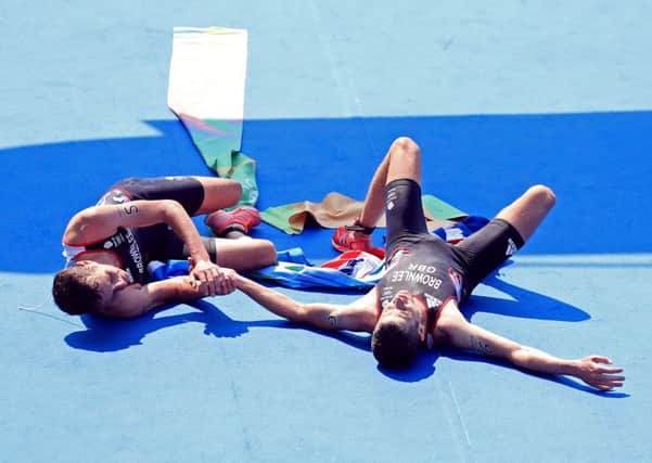 Great Britain's Alistair Brownlee (left) and brother Jonny embrace after winning Gold and Silver in the Men's Triathlon at Fort Copacabana (Picture: Mike Egerton/PA Wire)