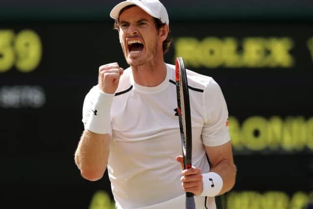 Andy Murray celebrates winning the second set during the men's singles final against Milos Raonic