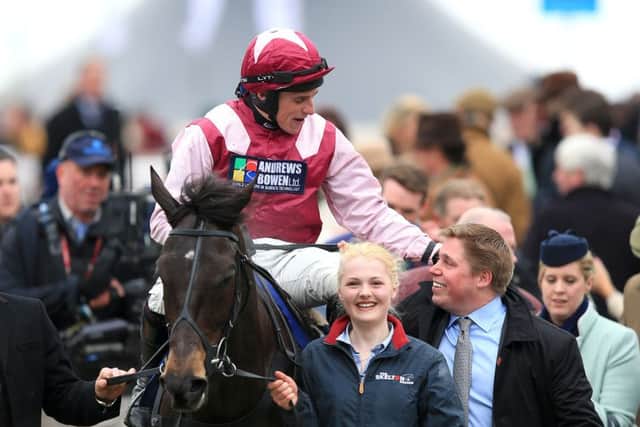 Jockey Harry Skelton with brother and trainer Dan Skelton after Superb Story wins the County Handicap Hurdle at the 2016 Cheltenham Festival. Picture: Mike Egerton/PA.