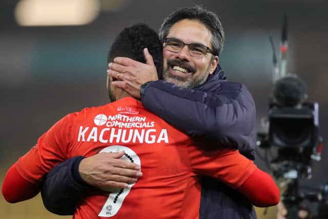 WELL PLAYED: Huddersfield Town's Elias Kachunga celebrates with manager David Wagner after the final whistle at Carrow Road. Picture: Chris Radburn/PA
