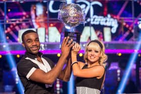 Joanne Clifton and Ore Oduba with the glitterball trophy after they won the final of the BBC1 show, Strictly Come Dancing.