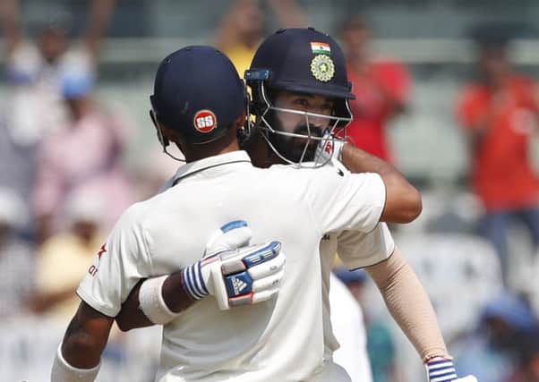 India captain Virat Kohli, front, hugs Lokesh Rahul after his century against England during the third day of the fifth Test in Chennai (Picture: Tsering Topgyal/AP).