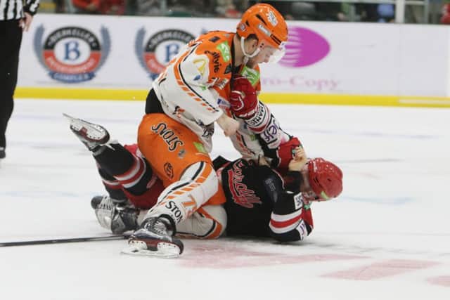 Steelers' Robert Dowd gets to grips with an opponent during a 3-2 defeat in Cardiff on Saturday night. Picture courtesy of Helen Brabon/EIHL.