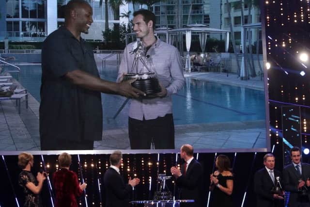 Andy Murray receives the Sports Personality of the Year award from Lennox Lewis. Photo: David Davies/PA Wire.