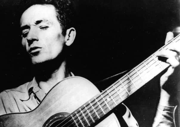 Woody Guthrie was best known for his song This Land is Your Land. (AP).