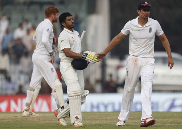 England's captain Alastair Cook exchanges a cursory handshake with India's triple century maker Karun Nair in Chennai (Picture: Tsering Topgyal).