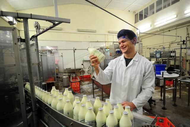 James Cartwright pictured in the milk bottling area.