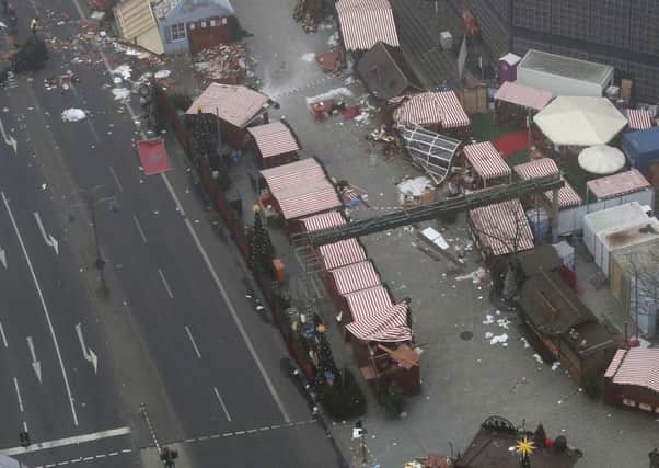 A trail of devastation is left behind in Berlin, Germany, after a truck ran into a crowded Christmas market and killed several people.