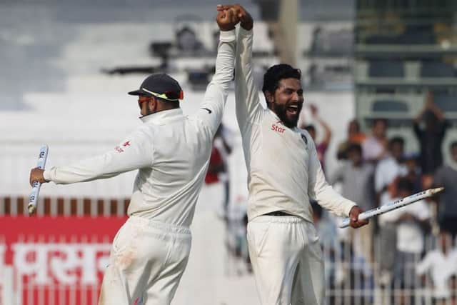 Indian cricket captain Virat Kohli, left, and teammate Ravindra Jadeja, right, celebrate winning in Chennai. Picture: AP/Tsering Topgyal.