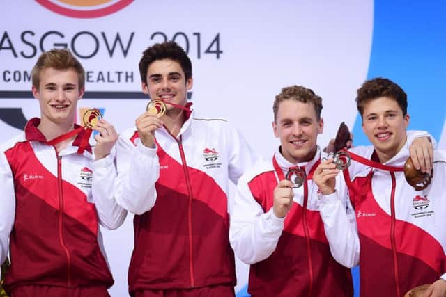 Team England's, l-r, Jack Laugher and Chris Mears celebrate gold, and Nick Baker-Robinson and Freddie Woodward bronze, in the synchronised 3m springboard final at the 2014 Commonwealth Games (Picture: Tim Ireland/PA Wire).