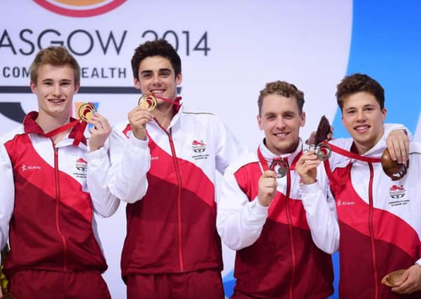 Team England's, l-r, Jack Laugher and Chris Mears celebrate gold, and Nick Baker-Robinson and Freddie Woodward bronze, in the synchronised 3m springboard final at the 2014 Commonwealth Games (Picture: Tim Ireland/PA Wire).