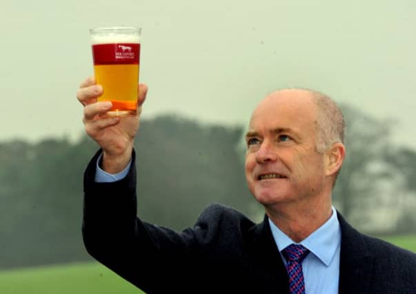 Nick Stafford holds aloft a pint of nectar. Pictures: Gary Longbottom
