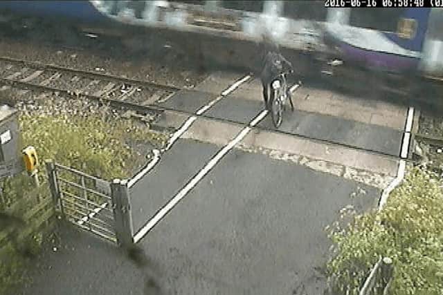 A cyclist coming within inches of being killed by a train near Leeds