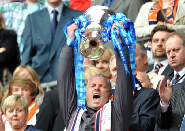 York City manager Gary Mills, who is back at Bootham Crescent for a second spell, celebrates promotion back to the Football League after the Minstermen's Conference play-off final victory over Luton Town at Wembley (Picture: Tony Johnson).