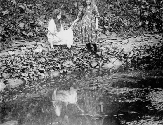Elsie Wright (left) and Frances Griffiths (right), the two girls responsible for The Cottingley Fairies photographic hoax.