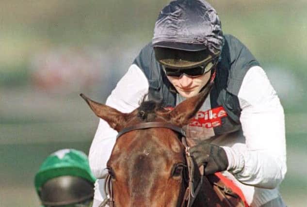 Cool Dawn ridden by Andrew Thornton clears the final fence to win the Cheltenham Gold Cup back in 1998. Picture DAVID JONES/PA.