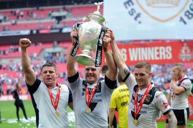 Hull's Lee Radford, Gareth Ellis and Marc Sneyd celebrate their Challenge Cup glory. (Picture: Jonathan Gawthorpe)