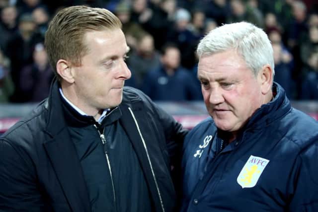 Aston Villa manager Steve Bruce and Leeds United manager Gary Monk greet each other at Villa Park