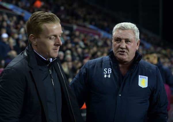 Garry Monk and Steve Bruce. shake hands after Thursday night's 1-1 draw at Villa Park.  Picture Bruce Rollinson