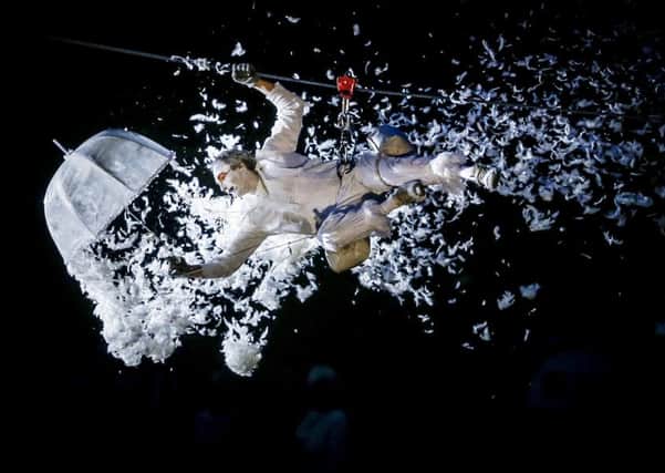 Performers dressed as angels take part in the Place des Anges spectacle in Hull, part of UK City of Culture 2017 and the Yorkshire Festival. PRESS ASSOCIATION Photo. Picture date: Saturday July 2, 2016. Up to 10,000 people have descended on Hull to watch Place des Anges. The aerial show sees white-clad angels appear on rooftops before taking off on suspended wires across the city. The event culminates with thousands of white feathers cascading onto the crowds below. Photo credit should read: Danny Lawson/PA Wire