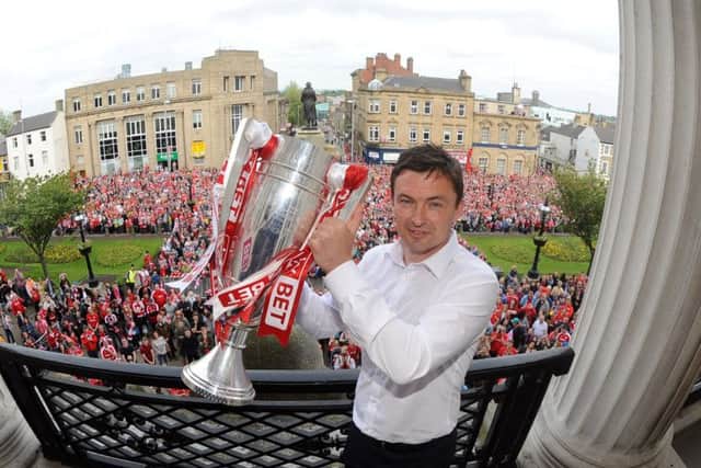 TOP MAN: Barnsley's League One Play-Off final homecoming parade at Barnsley Town Hall -  manager Paul Heckingbottom holds the trophy aloft. Picture: Simon Hulme.