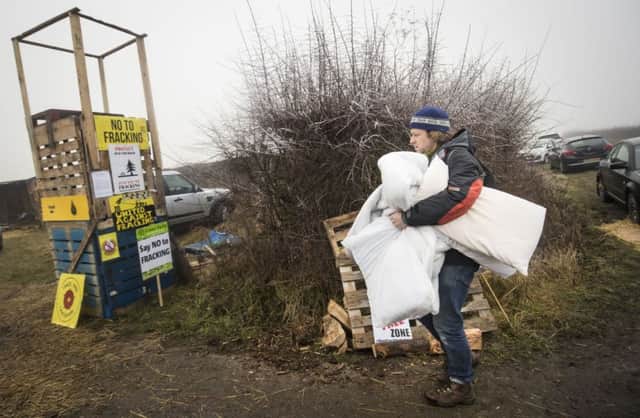 A protester at an anti-fracking camp near Kirby Misperton in Yorkshire as Friends of the Earth is admonished for making spurious allegations about the health risks.
