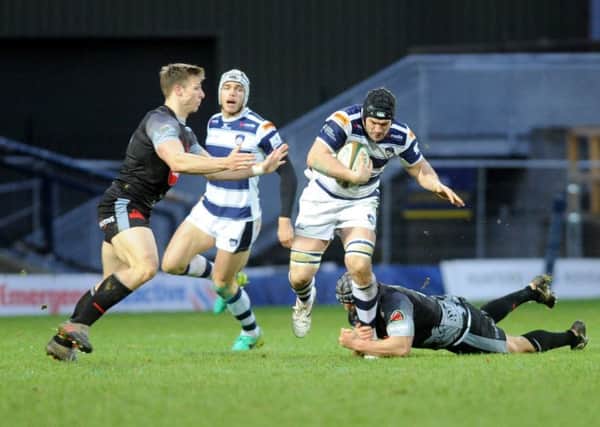 TOUGH DAY: Ryan Burrow tries to burst through for Carnegie against London Welsh. Picture: Steve Riding