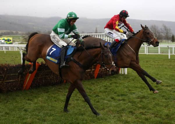 Cogry ridden by William Twiston-Davies (right) clears the last flight in company with Rocklander ridden by Adrian Heskin before going on to win The BetBright Casino Handicap Hurdle Race run at Cheltenham Racecourse. PRESS ASSOCIATION Photo. Picture date: Sunday January 1, 2017. See PA story RACING Cheltenham. Photo credit should read: Julian Herbert/PA Wire. RESTRICTIONS: Editorial Use only, commercial use is subject to prior permission from The Jockey Club/Cheltenham Racecourse.