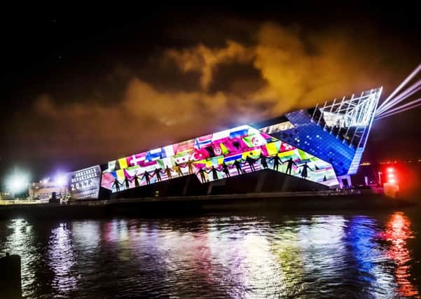 An art installation titled Arrivals and Departures by arts collective 'imitating the dog' is projected onto The Deep in Hull, forming part of the Made in Hull series marking the official opening of its tenure as UK City of Culture.