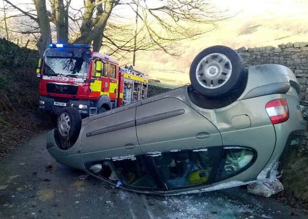 North Yorkshire fire service tweeted this picture of an overturned car on an icy road at Gunnerside, near Muker. A family of five suffered minor injuries.