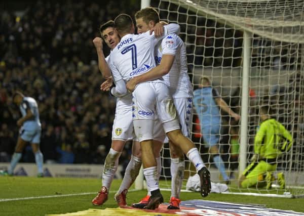 Chris Wood celebrates his second goal with Pablo Hernandez and Kemar Roofe.